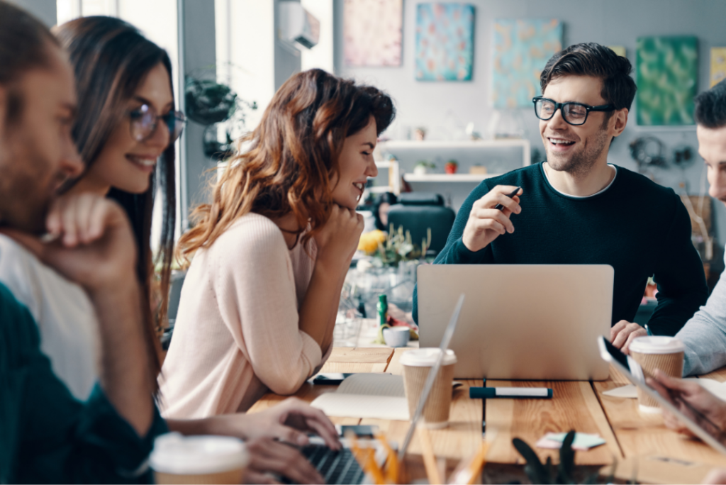 Professional NetSuite consultant in San Leeds collaborating with business team in modern office