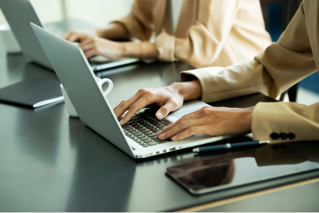 Professional NetSuite consultant in Edinburgh collaborating with business team in modern office